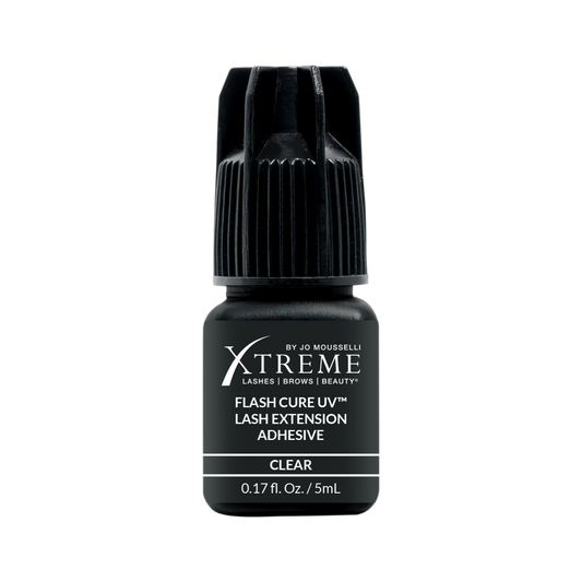 Bottle of Long lasting lash adhesive. Clear color